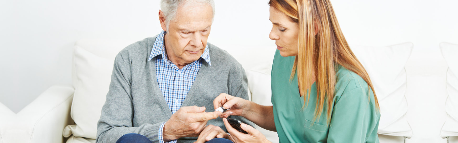 elderly man and nurse sitting