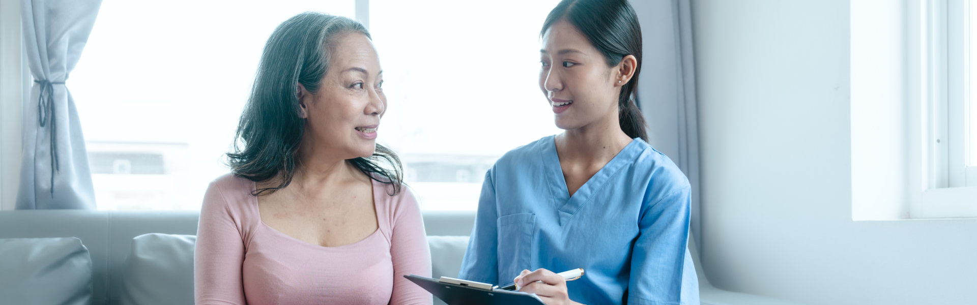 elderly woman setting an appointment to the caregiver